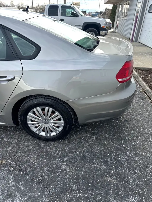 Silver sedan rear quarter panel and bumper